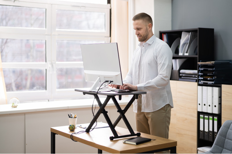 Using an Adjustable Laptop Desk From Los Angeles to Avoid Sitting All Day